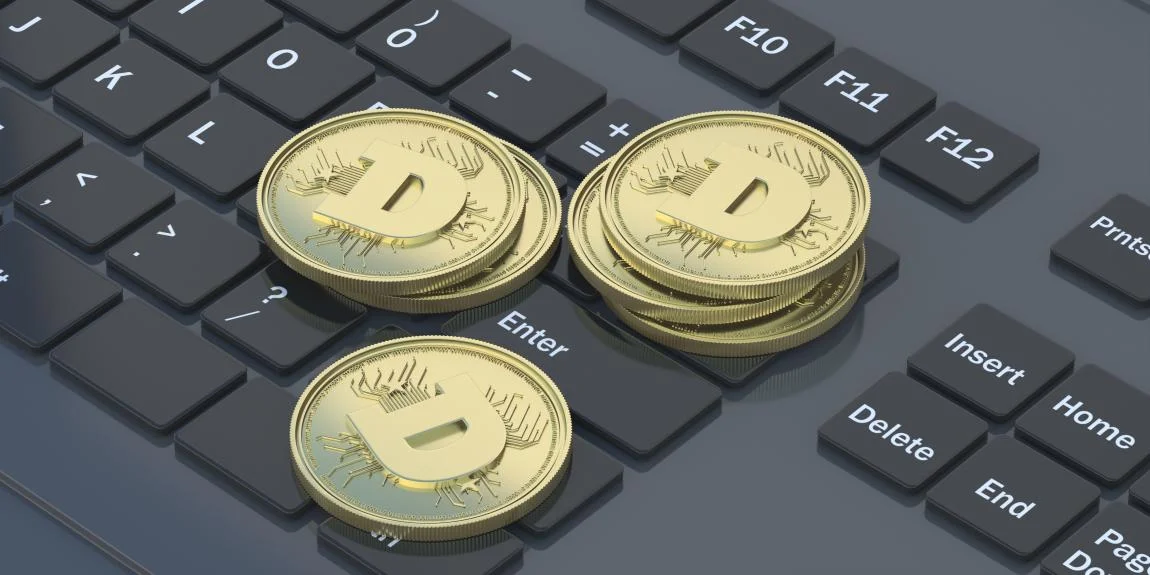  Crypto coins on top of laptop 